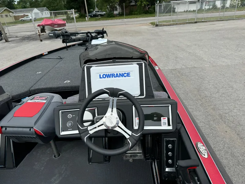 Slide: The Image of 2024 Ranger Z520R boat dashboard with Lowrance display and steering wheel. - 9