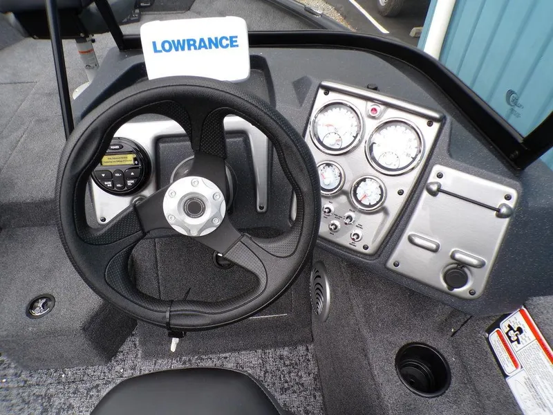 Slide: The Image of 2025 Tracker Pro Guide V-175 Combo dashboard with steering wheel and gauges. - 13