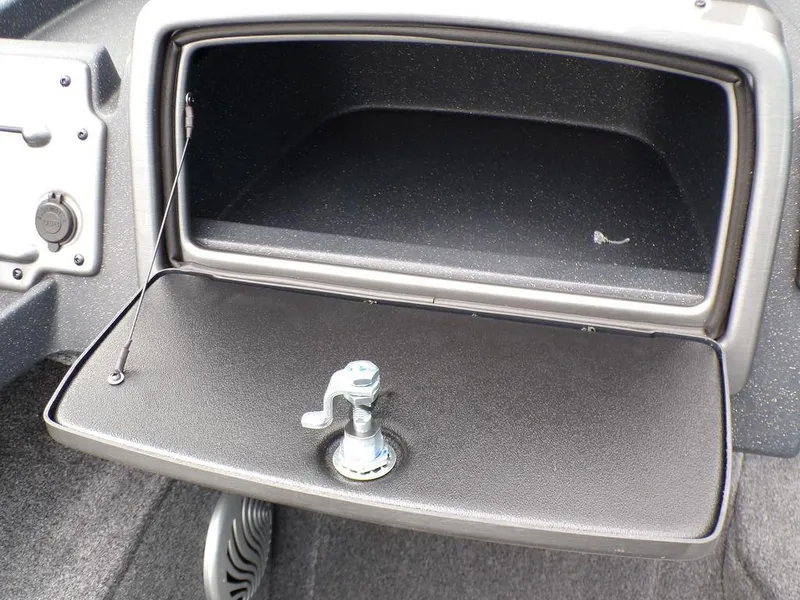 Slide: The Image of 2025 Tracker Pro Guide V-175 Combo boat glove compartment with open lid and latch. - 16