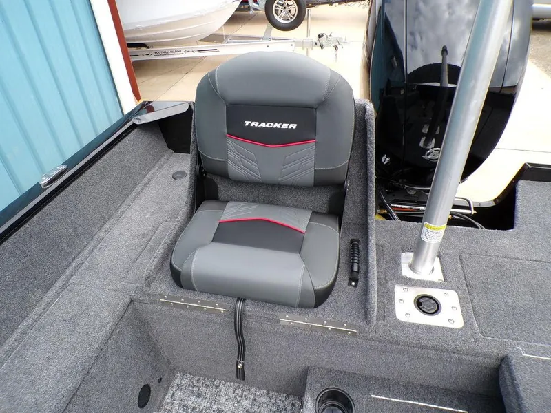 Slide: The Image of 2025 Tracker Pro Guide V-175 Combo boat seat, gray and black design. - 24