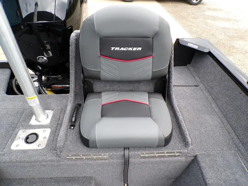 Slide: The Image of 2025 Tracker Pro Guide V-175 Combo boat seat, gray and black with red accents. - 25