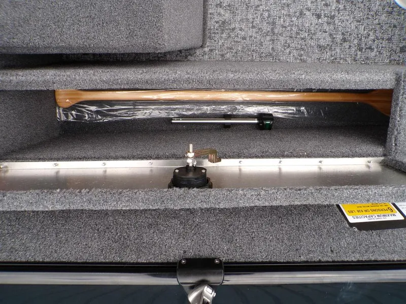 Slide: The Image of 2025 Tracker Pro Guide™ V-175 Combo storage compartment with paddle and equipment. - 29