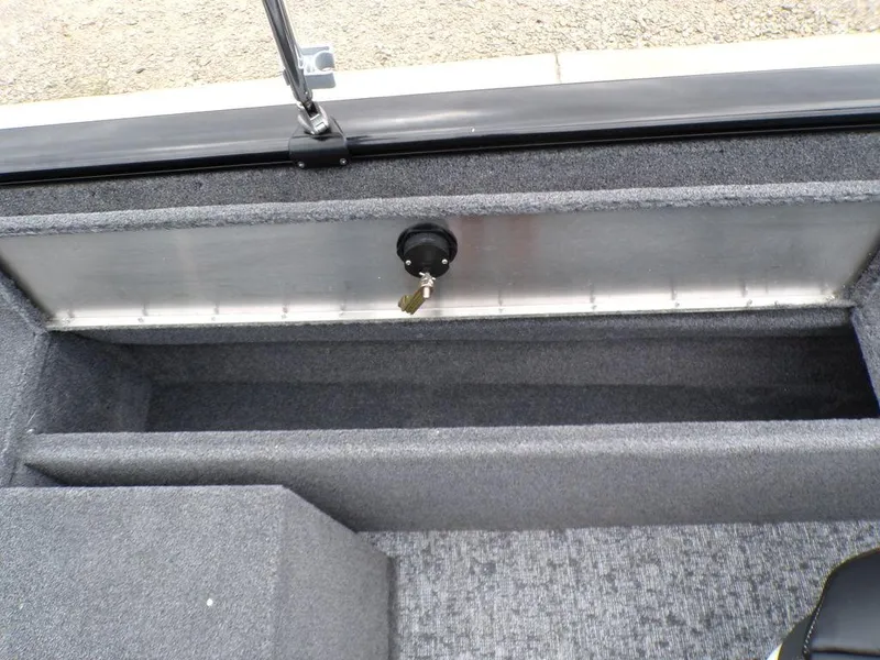 Slide: The Image of 2025 Tracker Pro Guide V-175 Combo boat storage compartment with carpeted interior. - 30