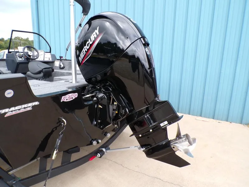 Slide: The Image of 2025 Tracker Pro Guide V-175 Combo boat with Mercury outboard motor, side view. - 6