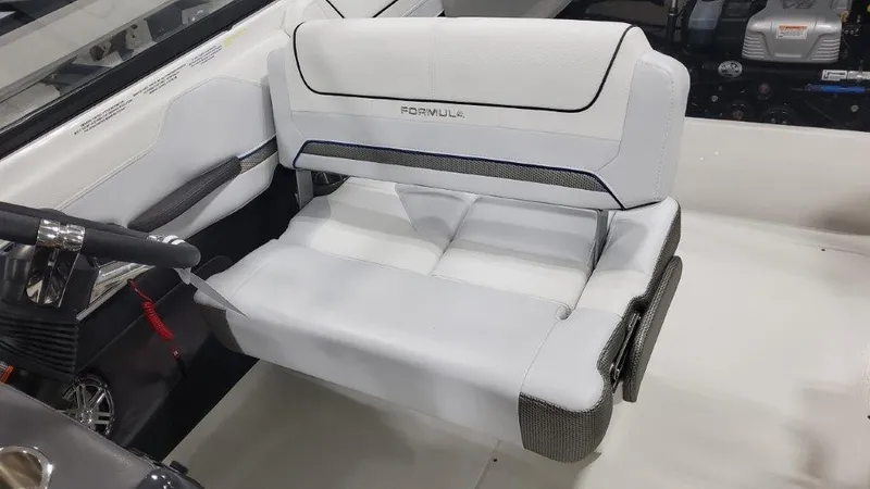 Slide: The Image of 2025 Formula 240 Bowrider interior seating and steering wheel. - 11