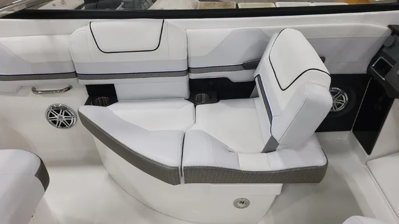 Slide: The Image of 2025 Formula 240 Bowrider interior seating with white and gray upholstery. - 13