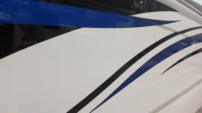 Slide: The Image of 2025 Formula 240 Bowrider boat with sleek blue and black graphics. - 3