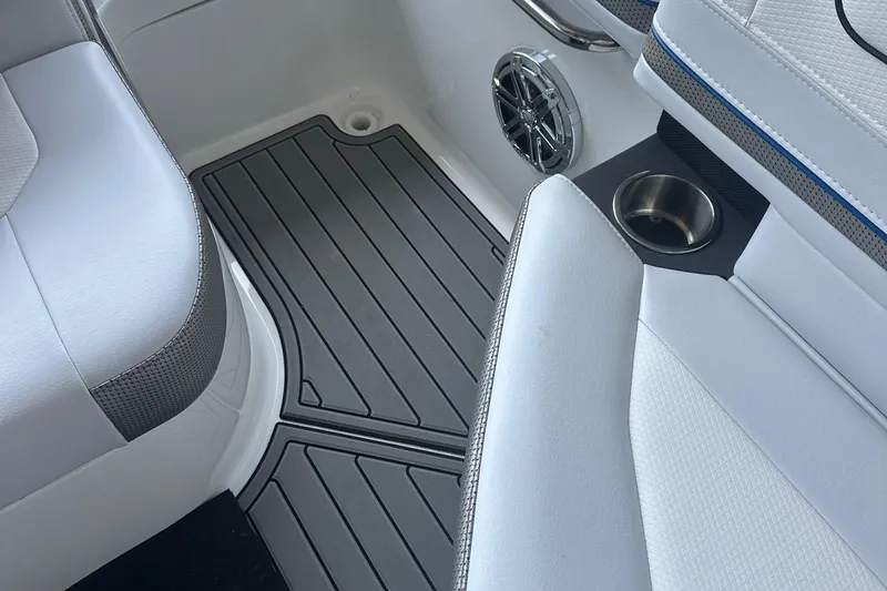 Slide: The Image of 2025 Formula 240 Bowrider interior with sleek seating and modern speaker system. - 9
