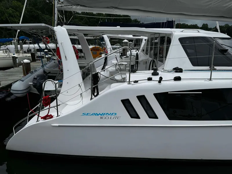 Slide: The Image of 2023 Seawind 1160 Lite catamaran docked at marina. - 4