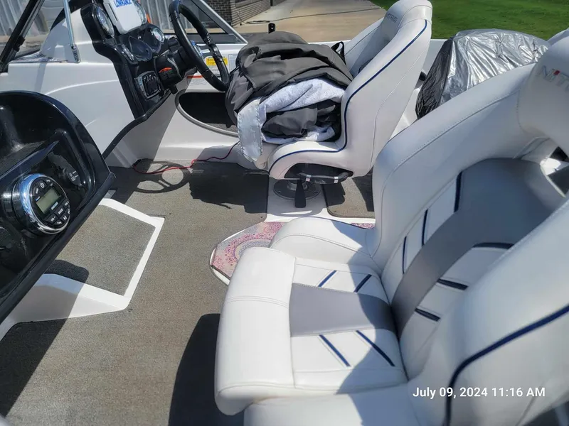 Slide: The Image of 2018 Nitro Z19 Sport boat interior with white seats and dashboard. - 3
