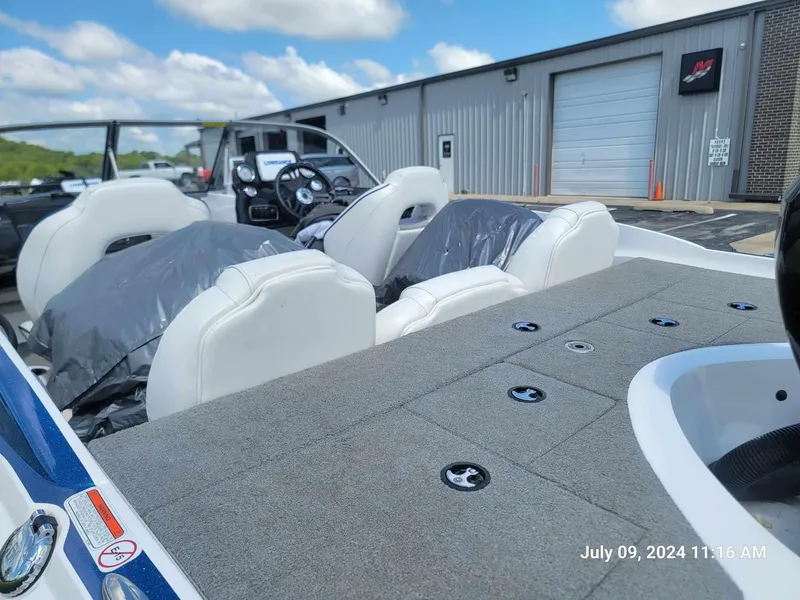 Slide: The Image of 2018 Nitro Z19 Sport boat interior with white seats and gray carpet. - 4