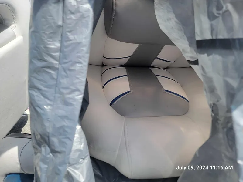 Slide: The Image of 2018 Nitro Z19 Sport boat seat covered with a tarp. - 5