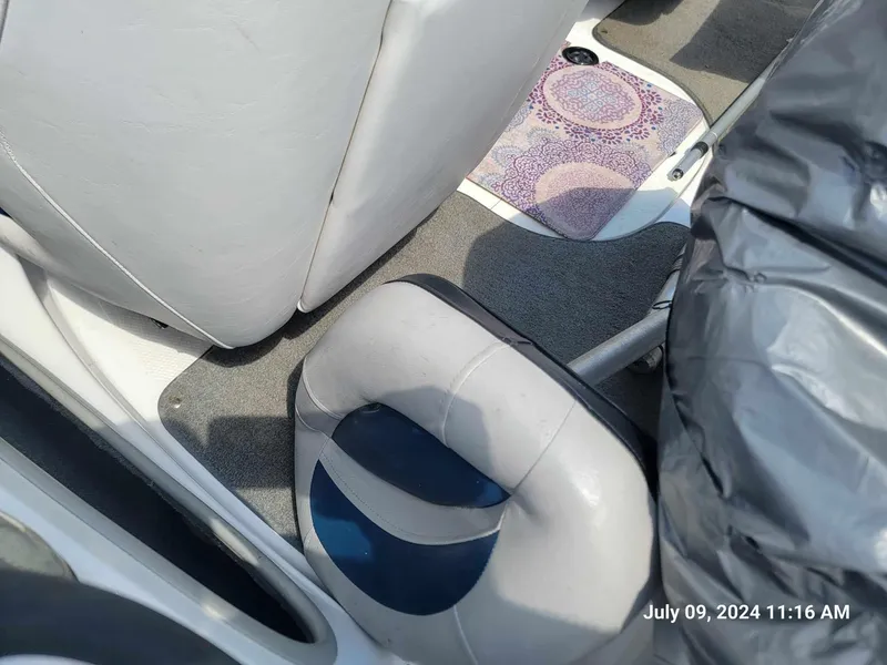 Slide: The Image of 2018 Nitro Z19 Sport boat interior with gray and blue seating. - 6