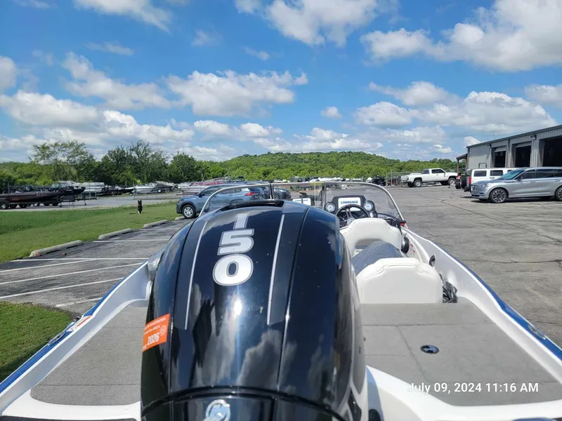 Slide: The Image of 2018 Nitro Z19 Sport boat with a 150 HP engine at a marina. - 8