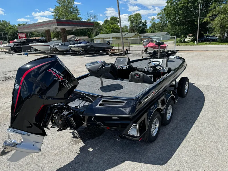 Slide: The Image of 2024 Ranger Z519 Garmin Ranger Cup Equipped boat in a parking lot. - 3