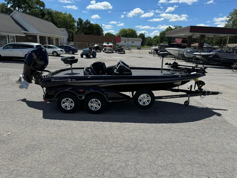 Slide: The Image of 2024 Ranger Z519 Garmin Ranger Cup Equipped boat on trailer in parking lot. - 4