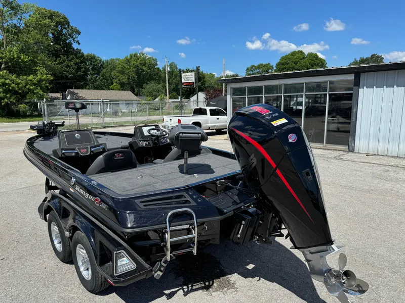 Slide: The Image of 2024 Ranger Z519 Garmin Ranger Cup Equipped boat with dual-axle trailer, parked outdoors. - 8