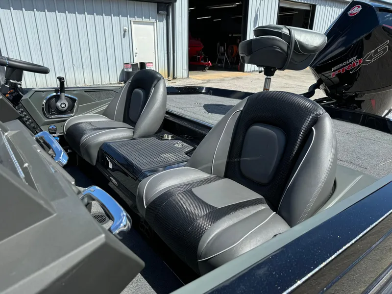 Slide: The Image of 2024 Ranger Z519 Garmin Ranger Cup boat interior with dual seats and steering console. - 9
