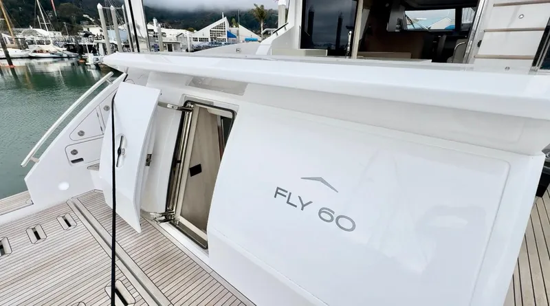 Slide: The Image of 2024 Azimut Fly 60 yacht docked, showcasing sleek design and modern features. - 1