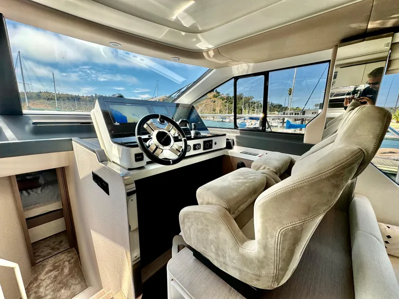 Slide: The Image of Luxurious interior of 2024 Azimut Fly 60 yacht with modern helm and plush seating. - 12