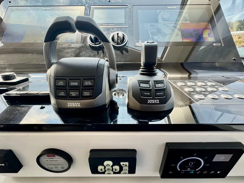 Slide: The Image of Control panel of 2024 Azimut Fly 60 yacht with Volvo Penta controls. - 14