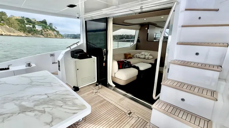 Slide: The Image of Luxurious 2024 Azimut Fly 60 yacht interior with elegant seating and scenic ocean view. - 2