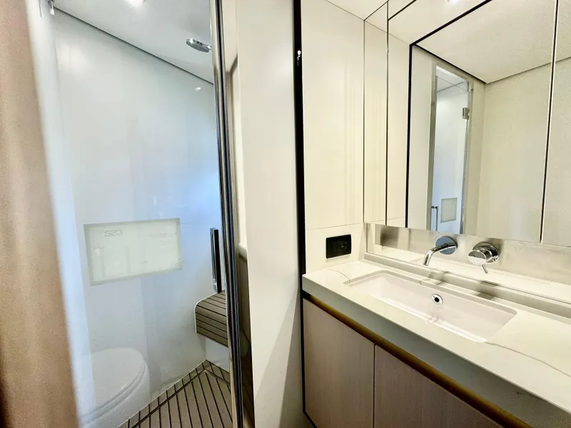 Slide: The Image of Luxurious bathroom in 2024 Azimut Fly 60 yacht with modern fixtures and sleek design. - 21