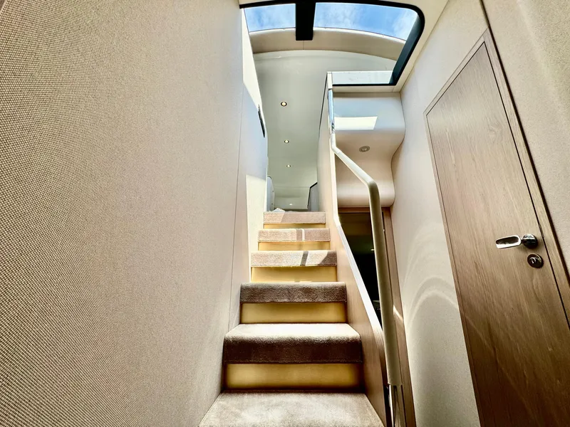 Slide: The Image of Interior staircase of 2024 Azimut Fly 60 yacht with skylight. - 31