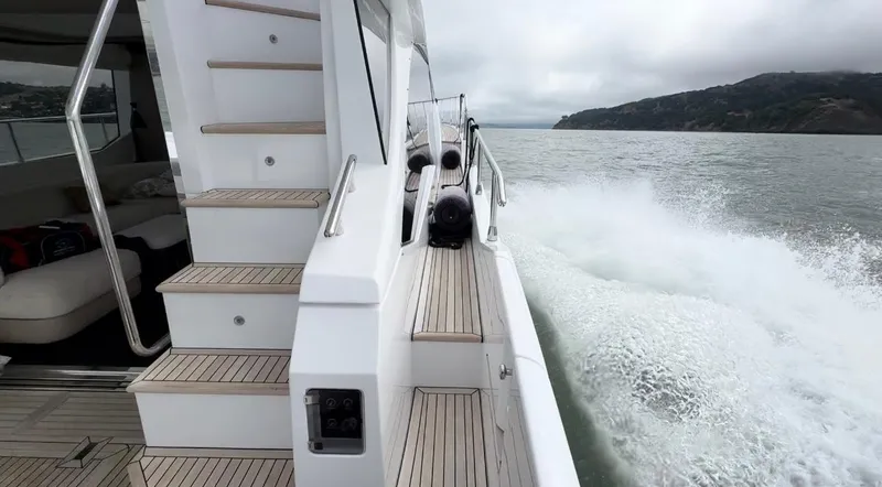 Slide: The Image of 2024 Azimut Fly 60 yacht cruising on open water, showcasing sleek design and luxury. - 34