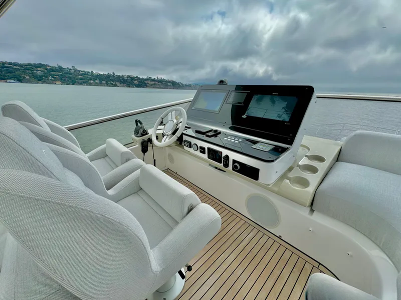 Slide: The Image of 2024 Azimut Fly 60 yacht helm with modern controls and plush seating. - 37