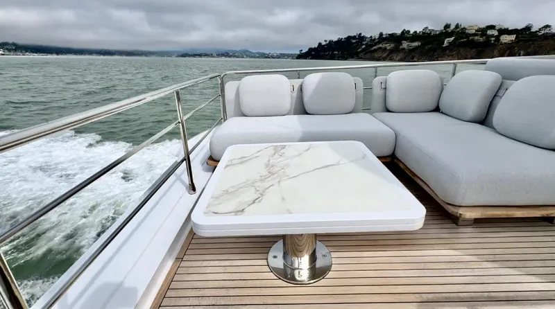Slide: The Image of Luxurious 2024 Azimut Fly 60 yacht deck with elegant seating and marble table. - 44