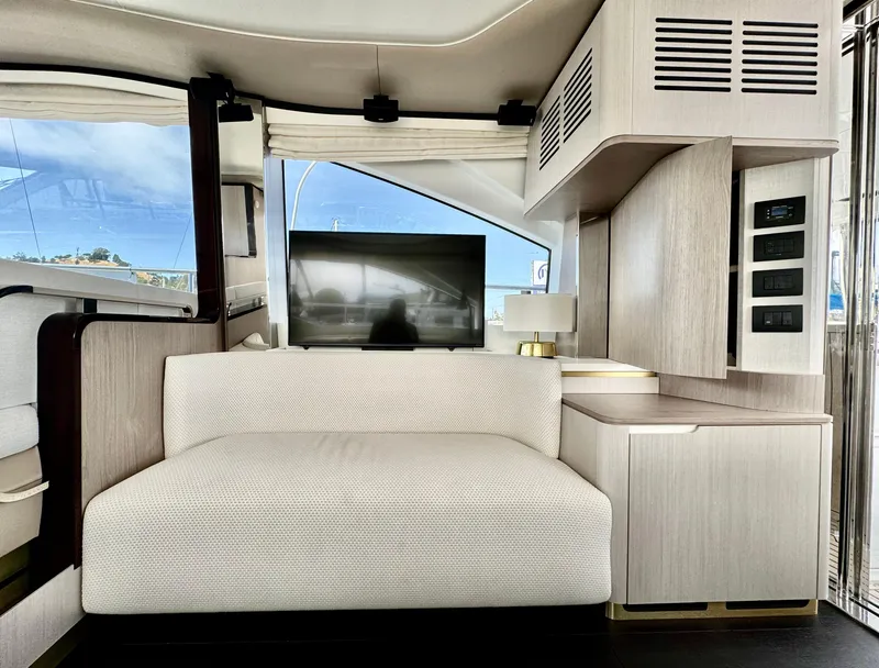 Slide: The Image of Luxurious interior of 2024 Azimut Fly 60 yacht with modern seating and entertainment area. - 6
