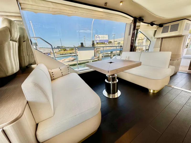 Slide: The Image of Luxurious interior of 2024 Azimut Fly 60 yacht with modern seating and panoramic windows. - 7