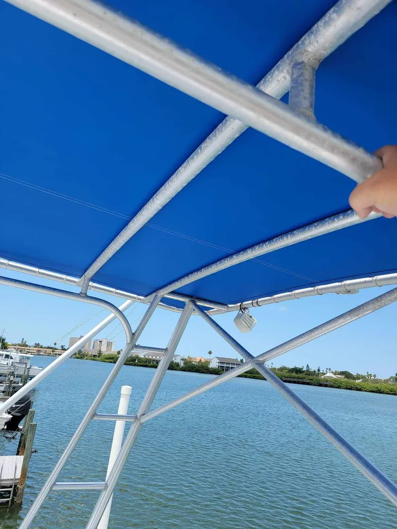 Slide: The Image of Blue canopy on 1997 Luhrs 32 Open boat with water view. - 20