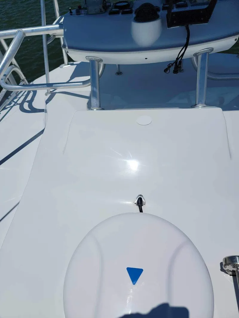 Slide: The Image of 1997 Luhrs 32 Open boat deck with control panel and railing. - 35