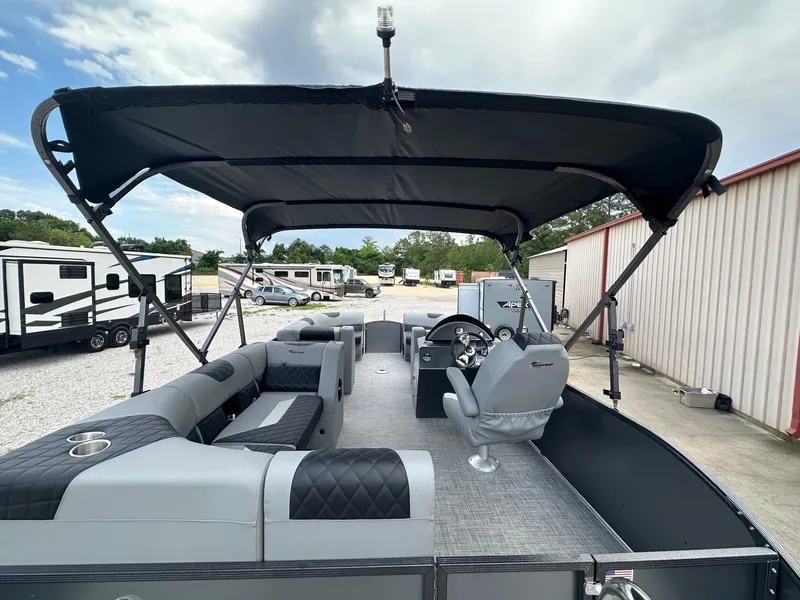 Slide: The Image of 2024 Massimo Marine P-21R pontoon boat with canopy, gray seating, and steering console. - 5