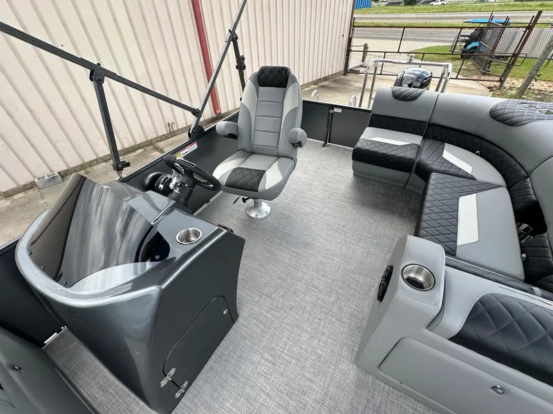 Slide: The Image of 2024 Massimo Marine P-21R boat interior with captain's chair and cushioned seating. - 7