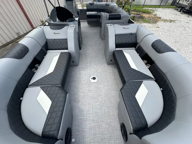 Slide: The Image of 2024 Massimo Marine P-21R pontoon boat interior with luxurious seating. - 9