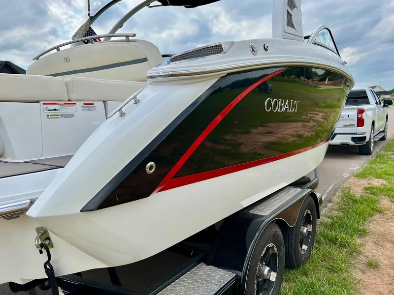 Slide: The Image of 2019 Cobalt R3 boat on a trailer, side view with red and black accents. - 3