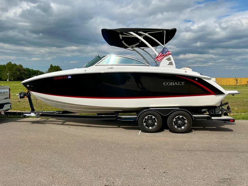 Slide: The Image of 2019 Cobalt R3 boat on a trailer with an American flag. - 32