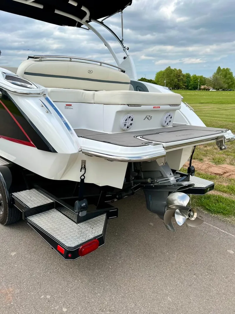 Slide: The Image of 2019 Cobalt R3 boat on trailer, rear view with propeller and swim platform. - 4