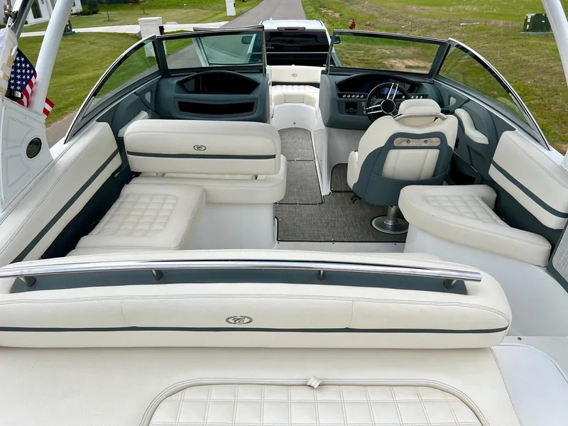 Slide: The Image of 2019 Cobalt R3 boat interior with white leather seating and modern dashboard. - 7