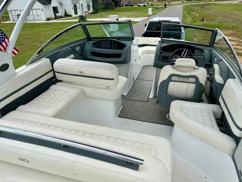 Slide: The Image of 2019 Cobalt R3 boat interior with white leather seating and modern dashboard. - 8