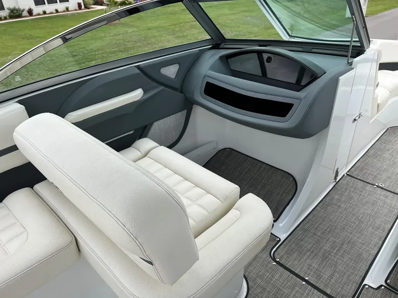 Slide: The Image of 2019 Cobalt R3 boat interior with white seating and modern dashboard. - 9