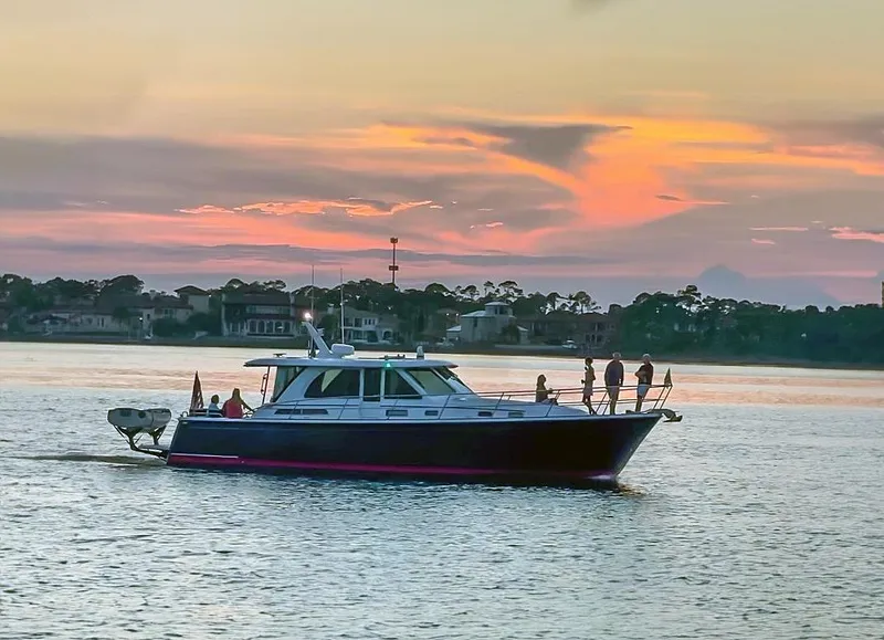The Image of 2017 Sabre 45 Salon Express yacht cruising at sunset on calm waters. - 0