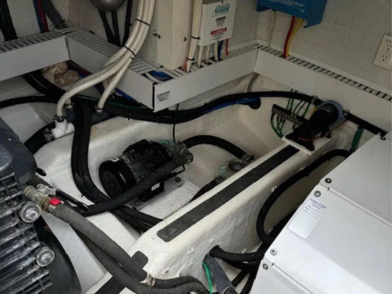 Slide: The Image of Engine room of 2017 Sabre 45 Salon Express with visible wiring and components. - 12