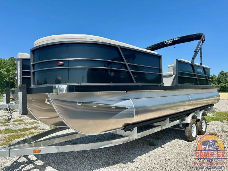 Slide: The Image of 2024 Massimo Marine P24-LTD QUAD pontoon boat on a trailer. - 10