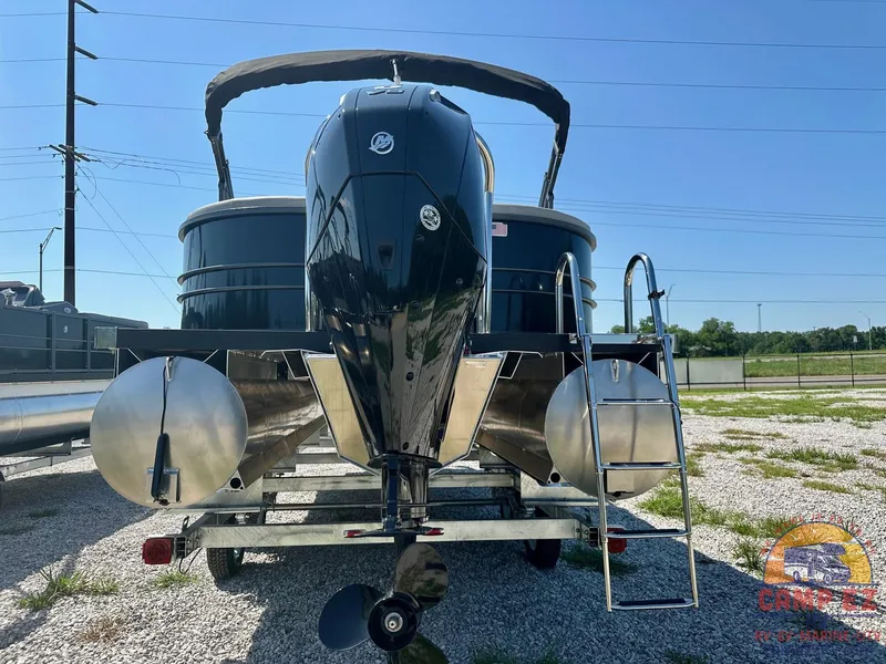 Slide: The Image of 2024 Massimo Marine P24-LTD QUAD pontoon boat rear view with outboard motor and ladder. - 7