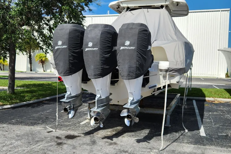 Slide: The Image of 2014 Boston Whaler 350 Outrage with triple Mercury outboard engines. - 11