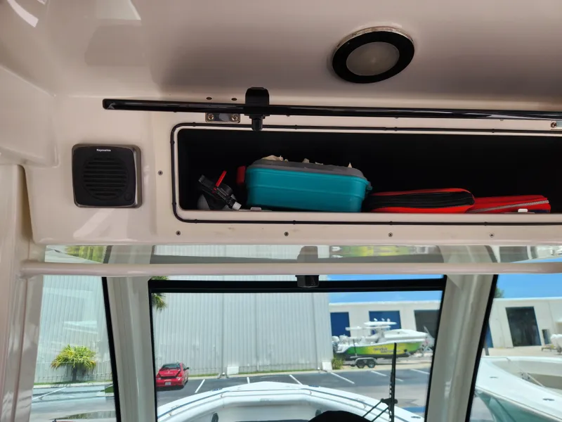 Slide: The Image of Storage compartment inside a 2014 Boston Whaler 350 Outrage boat. - 14